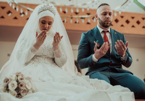 Muslim bride and groom praying at the mosque during a wedding ceremony. Selective focus . High quality photo